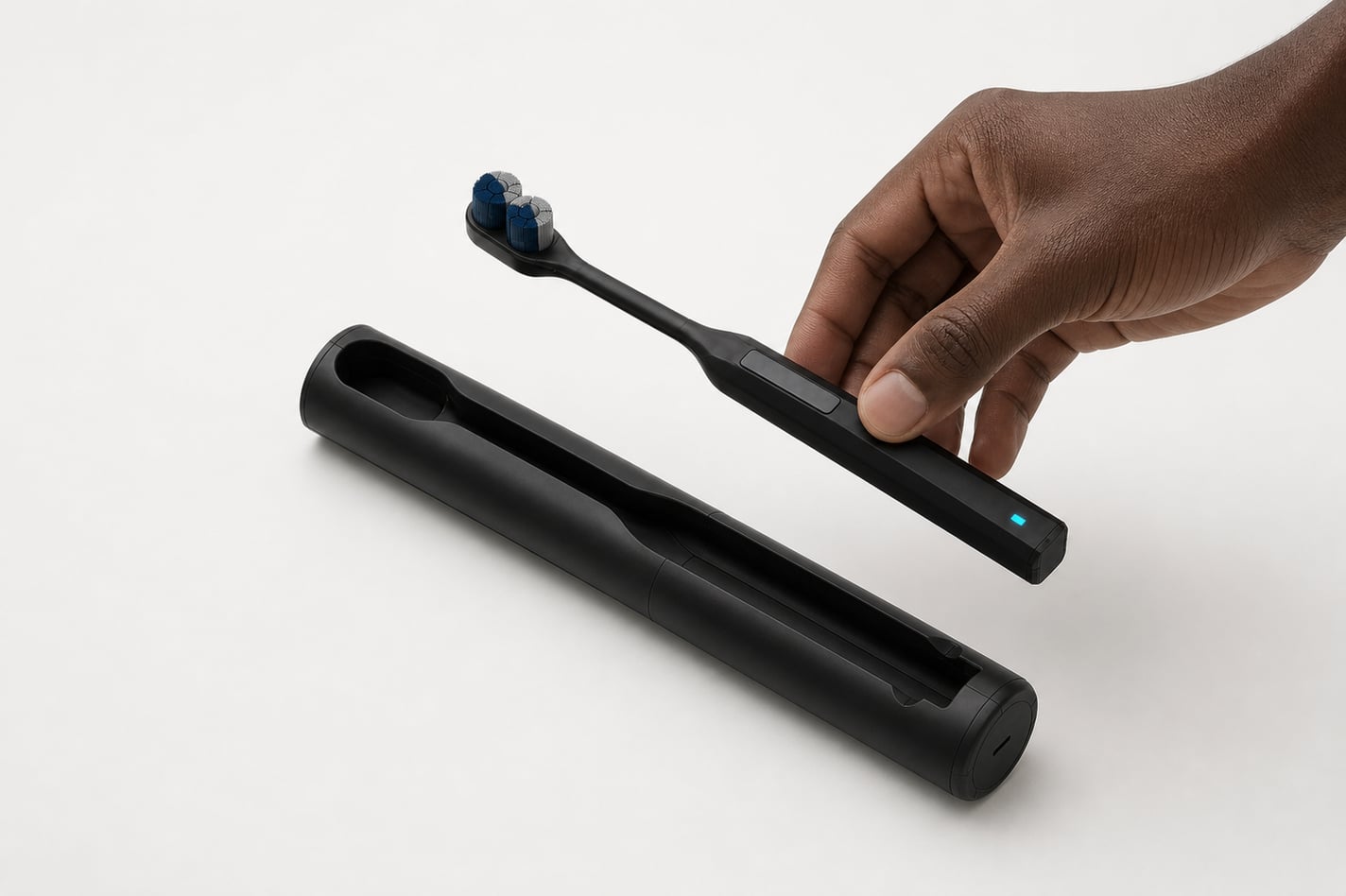 Render of a hand lowering the brush towards the open case, the moment it is stowed and begins charging